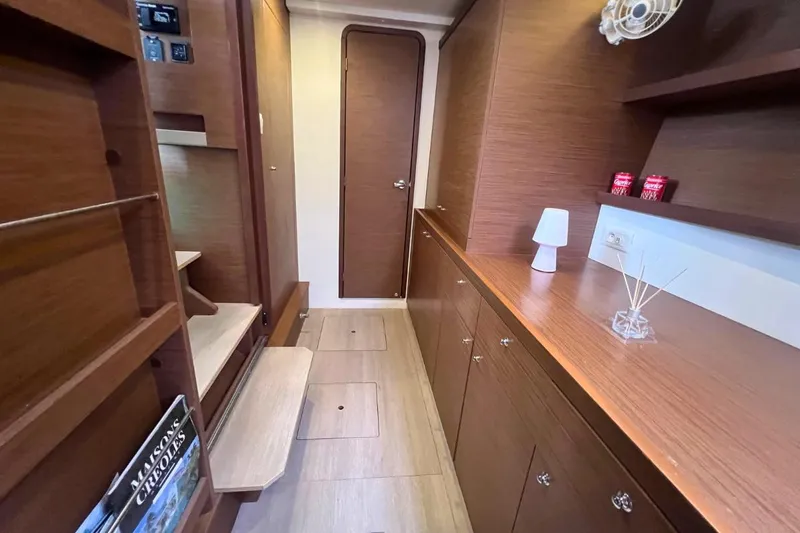 Ile En Ile Yacht Photos Pics Interior of 2018 Lagoon 42 yacht with wooden cabinetry and modern decor.