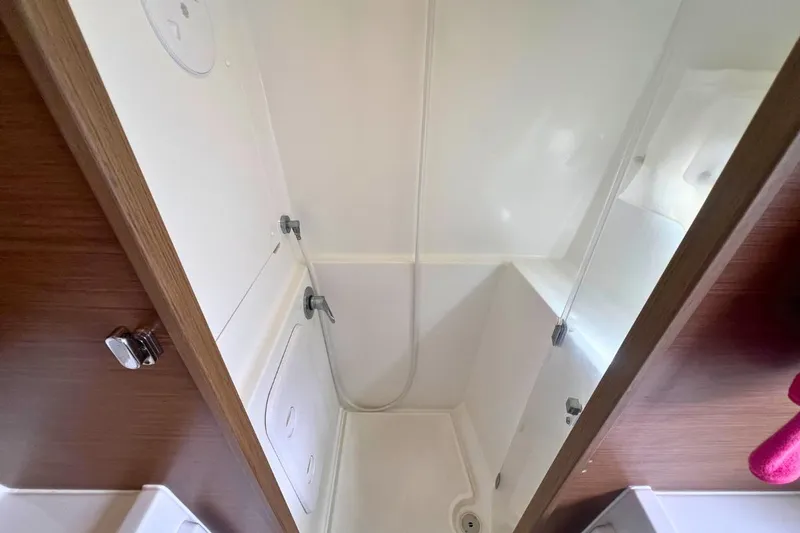 Ile En Ile Yacht Photos Pics Shower area in a 2018 Lagoon 42 yacht, featuring sleek design and modern fixtures.