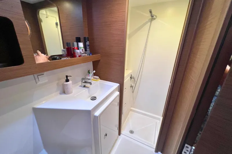 Ile En Ile Yacht Photos Pics Bathroom interior of 2018 Lagoon 42 yacht with sink and shower.