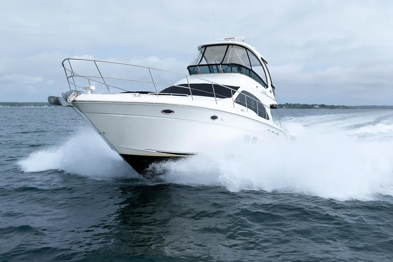  Yacht Photos Pics 2010 Sea Ray 520 Sedan Bridge yacht cruising on open water.