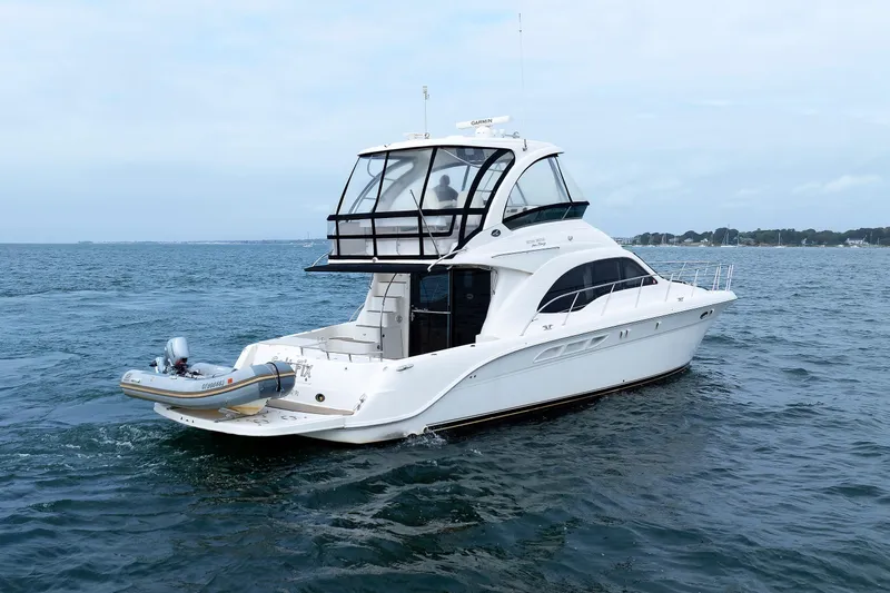  Yacht Photos Pics 2010 Sea Ray 520 Sedan Bridge yacht on open water, rear view.