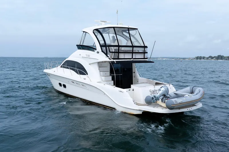  Yacht Photos Pics 2010 Sea Ray 520 Sedan Bridge yacht cruising on open water.