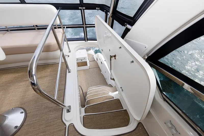  Yacht Photos Pics Interior view of 2010 Sea Ray 520 Sedan Bridge yacht staircase and seating area.