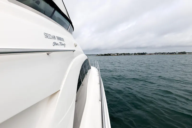  Yacht Photos Pics 2010 Sea Ray 520 Sedan Bridge yacht cruising on open water.