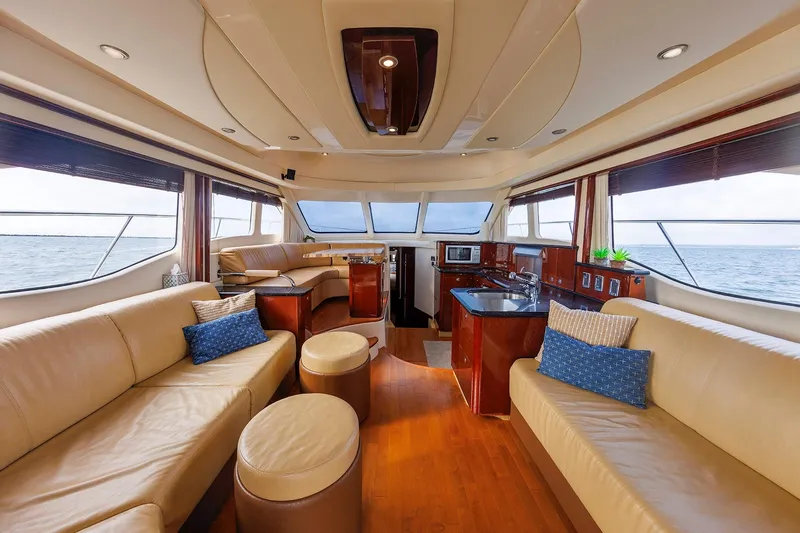  Yacht Photos Pics Luxurious interior of 2010 Sea Ray 520 Sedan Bridge yacht with elegant seating and ocean view.