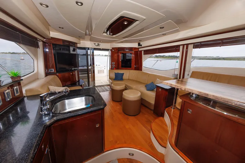  Yacht Photos Pics Luxurious interior of 2010 Sea Ray 520 Sedan Bridge yacht with elegant furnishings.