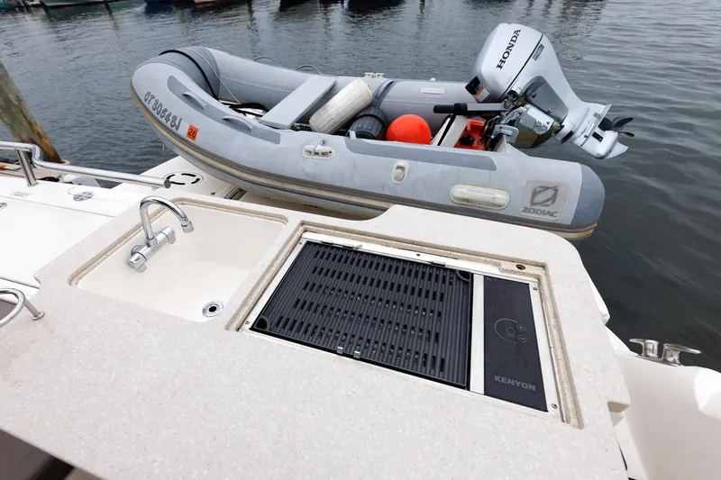  Yacht Photos Pics Outdoor kitchen on 2010 Sea Ray 520 Sedan Bridge with Zodiac inflatable boat.