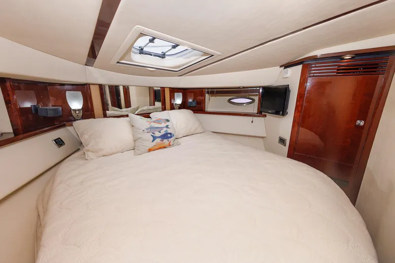  Yacht Photos Pics Luxurious bedroom interior of 2010 Sea Ray 520 Sedan Bridge yacht with plush bedding.