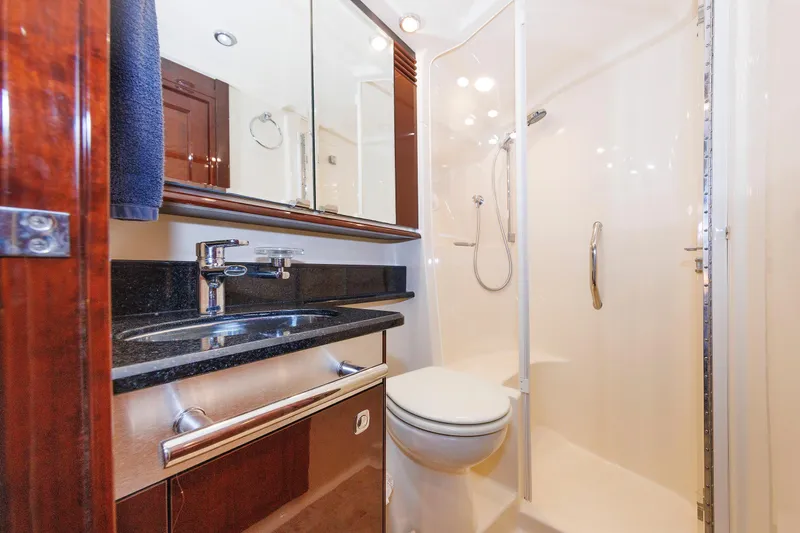  Yacht Photos Pics Luxurious bathroom in 2010 Sea Ray 520 Sedan Bridge yacht with modern fixtures.