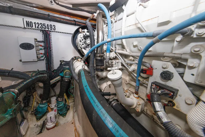  Yacht Photos Pics Engine room of 2010 Sea Ray 520 Sedan Bridge with visible pipes and wiring.