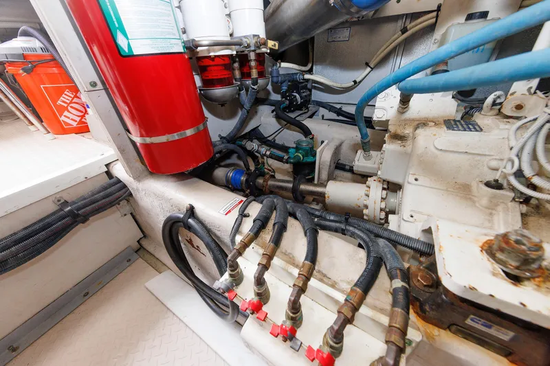  Yacht Photos Pics Engine room of 2010 Sea Ray 520 Sedan Bridge with visible fire extinguisher and hoses.