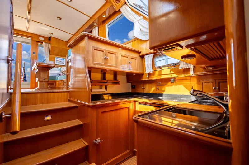 Persistence Yacht Photos Pics Luxurious wooden interior of 2008 Grand Banks 47 Eastbay FB yacht kitchen.