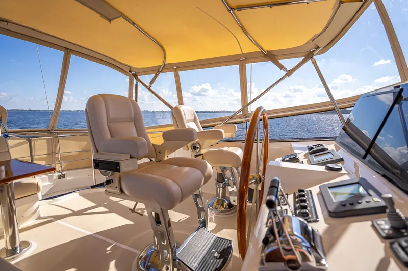 Persistence Yacht Photos Pics Luxurious 2008 Grand Banks 47 Eastbay FB yacht interior with helm and seating.