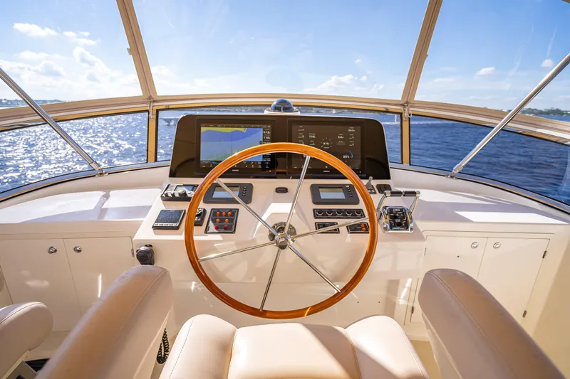 Persistence Yacht Photos Pics 2008 Grand Banks 47 Eastbay FB helm with wooden steering wheel and navigation equipment.