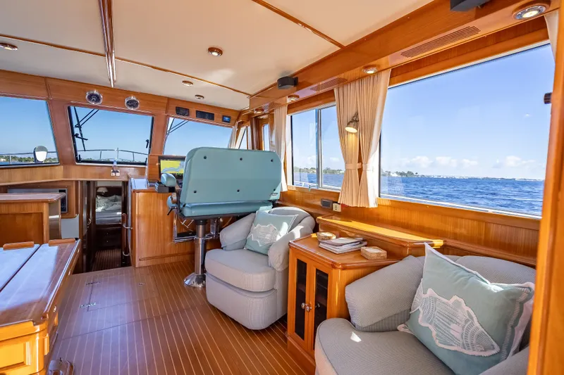 Persistence Yacht Photos Pics Interior of 2008 Grand Banks 47 Eastbay FB yacht with elegant wood finish and ocean view.