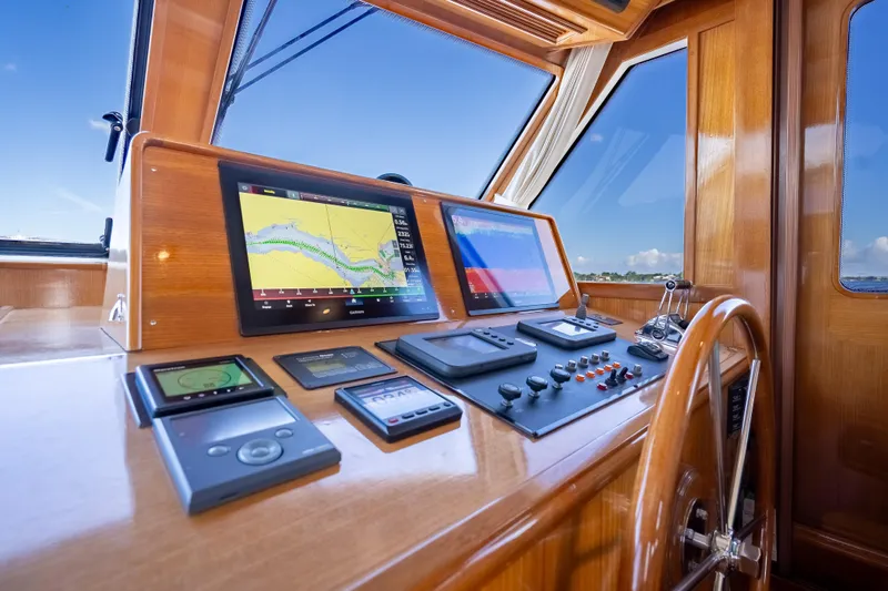 Persistence Yacht Photos Pics Helm of 2008 Grand Banks 47 Eastbay FB with navigation screens and controls.