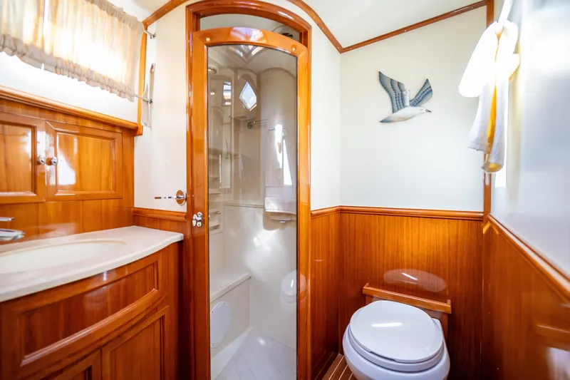Persistence Yacht Photos Pics Luxurious 2008 Grand Banks 47 Eastbay FB yacht bathroom with wood accents and modern fixtures.
