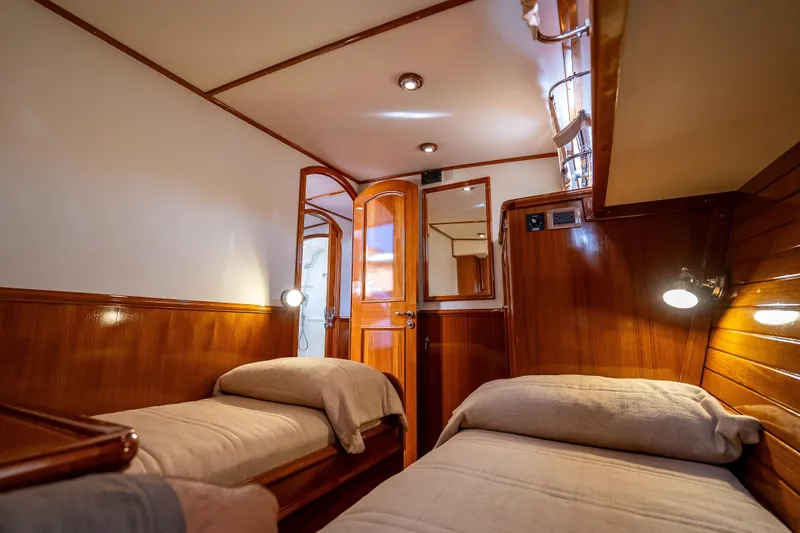 Persistence Yacht Photos Pics Luxurious wooden cabin interior of 2008 Grand Banks 47 Eastbay FB yacht.