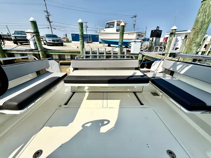  Yacht Photos Pics 2020 Jeanneau NC Sport 895 boat interior with seating and dock view.