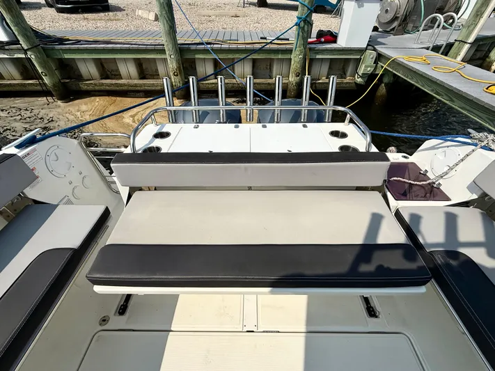  Yacht Photos Pics 2020 Jeanneau NC Sport 895 boat with seating and rod holders at the dock.