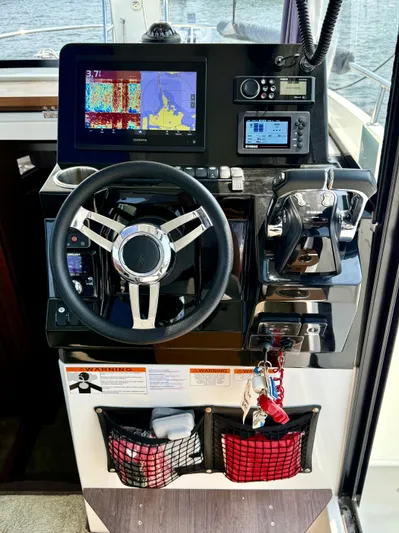  Yacht Photos Pics 2020 Jeanneau NC Sport 895 helm with navigation system and controls.