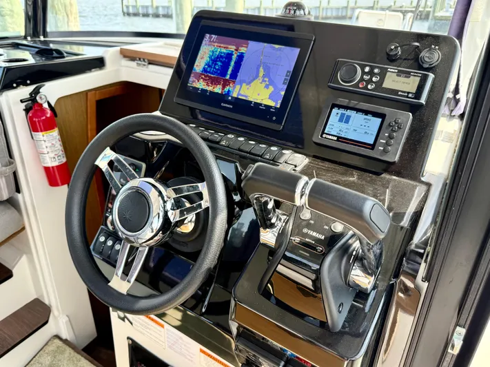  Yacht Photos Pics Helm of 2020 Jeanneau NC Sport 895 with navigation and control systems.