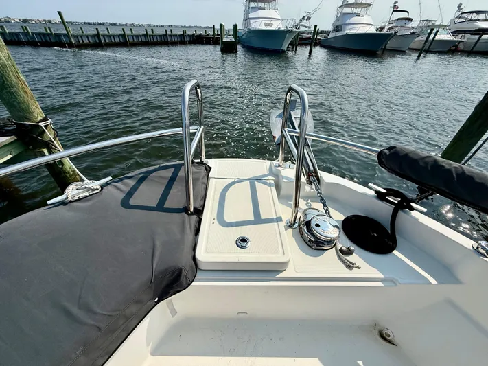  Yacht Photos Pics 2020 Jeanneau NC Sport 895 boat deck with railing, docked at marina.