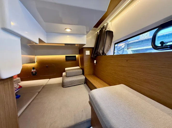  Yacht Photos Pics Interior of 2020 Jeanneau NC Sport 895 boat, featuring cozy seating and modern design.