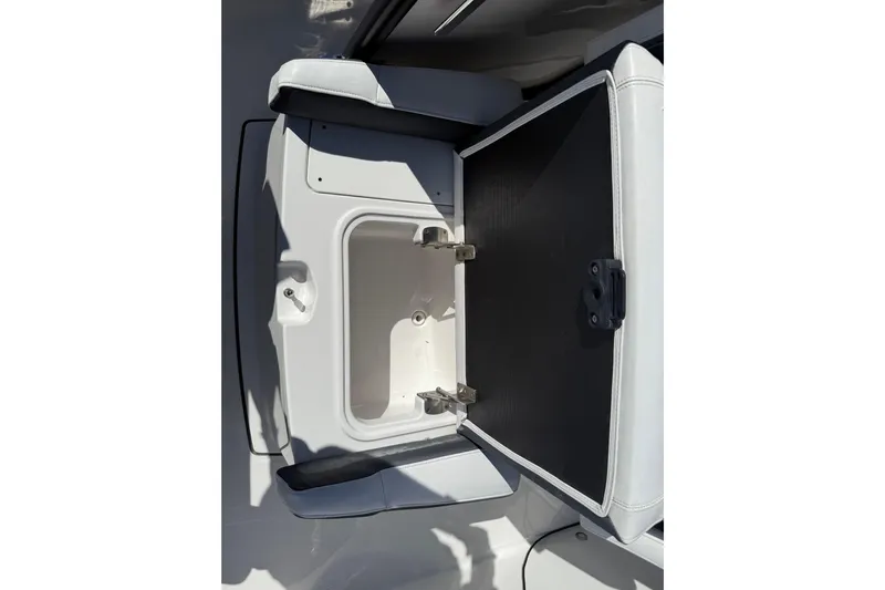 Yacht Photos Pics Open storage compartment on 2022 Blackfin 272 CC boat, showcasing interior space.