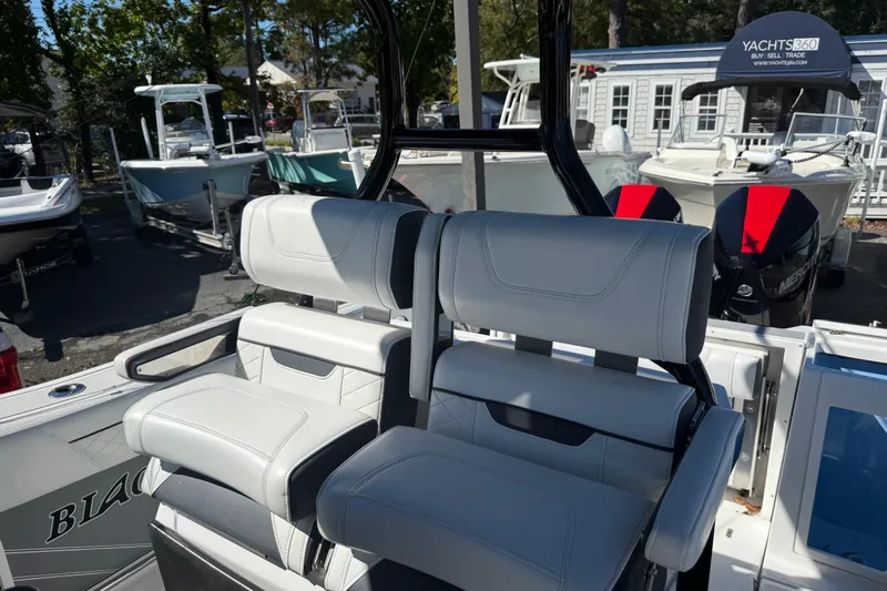  Yacht Photos Pics 2022 Blackfin 272 CC boat with dual cushioned seats and sleek design.
