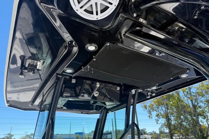  Yacht Photos Pics 2022 Blackfin 272 CC boat's sleek black overhead console with speaker and lights.