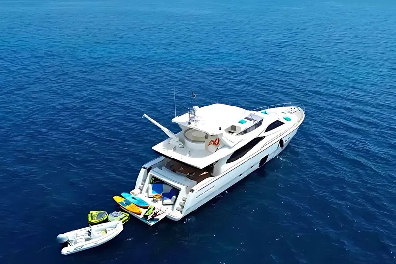 M/y Argo Yacht Photos Pics Luxurious 2006 Ferretti Yachts 780 on open sea with water sports equipment.