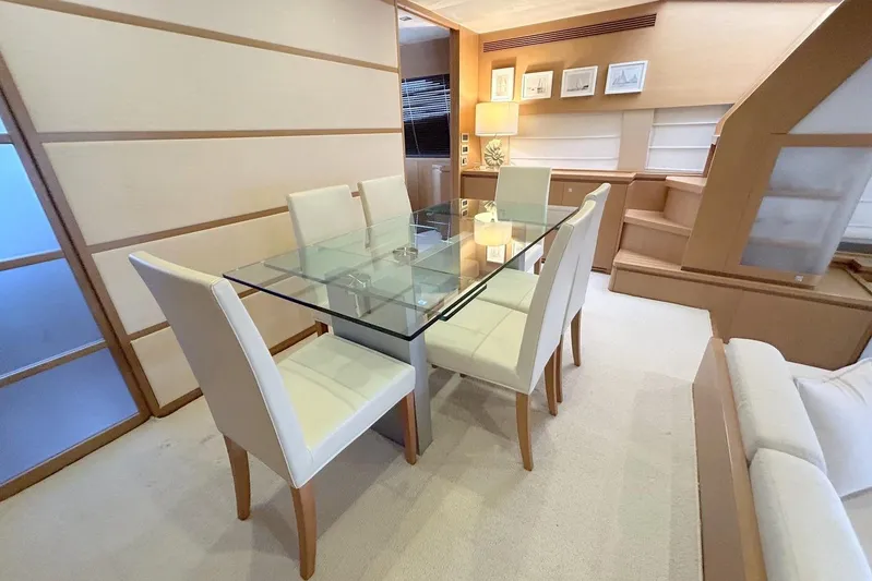 M/y Argo Yacht Photos Pics Luxurious dining area in a 2006 Ferretti Yachts 780 with glass table and white chairs.