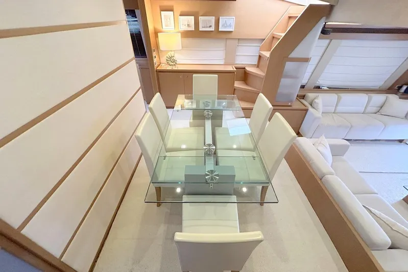 M/y Argo Yacht Photos Pics Luxurious interior of 2006 Ferretti Yachts 780 with glass dining table and modern decor.