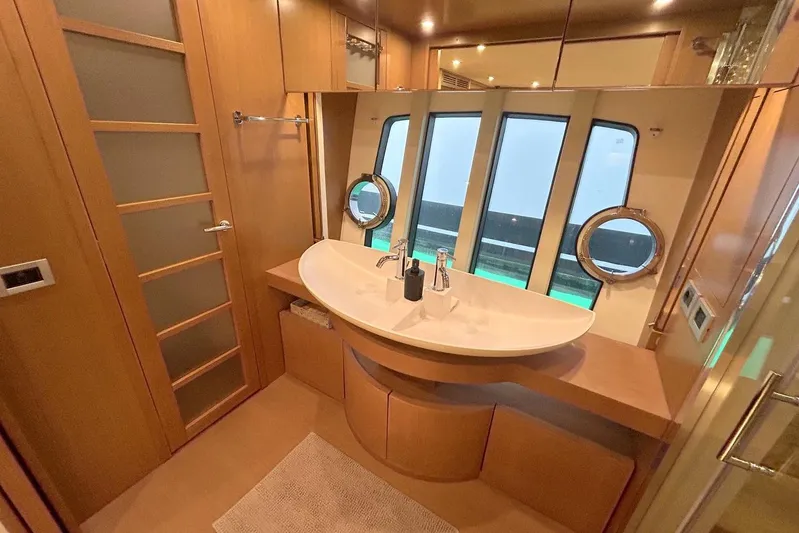 M/y Argo Yacht Photos Pics Luxurious bathroom interior of 2006 Ferretti Yachts 780 with modern fixtures and large windows.