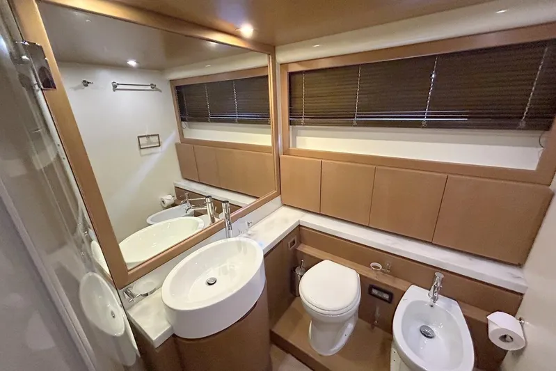 M/y Argo Yacht Photos Pics Luxurious bathroom in 2006 Ferretti Yachts 780, featuring modern fixtures and elegant wood finishes.