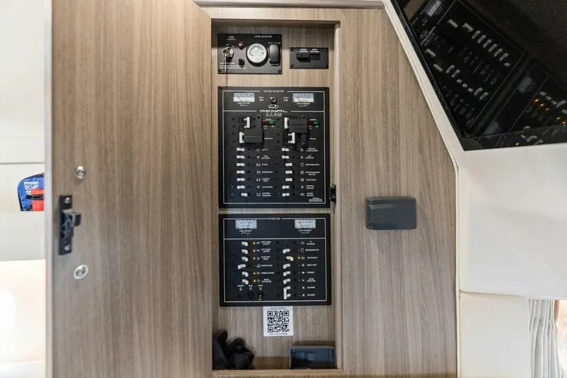 Snuffleupagus Yacht Photos Pics Electrical control panel inside 2020 Regal 33 XO boat, featuring switches and gauges.
