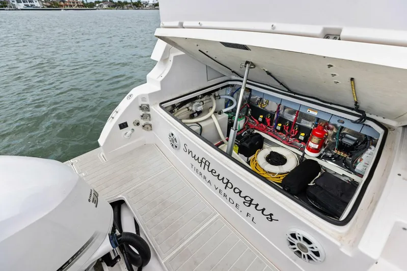 Snuffleupagus Yacht Photos Pics 2020 Regal 33 XO boat with open engine compartment, showing wiring and equipment.