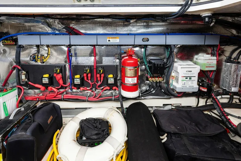 Snuffleupagus Yacht Photos Pics Engine room of 2020 Regal 33 XO boat with electrical systems and safety equipment.