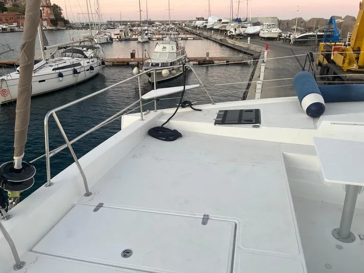  Yacht Photos Pics 2019 Bali 4.3 catamaran docked at marina with other boats at sunset.
