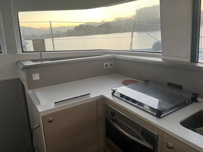  Yacht Photos Pics Modern kitchen area on a 2019 Bali 4.3 catamaran with scenic water view.