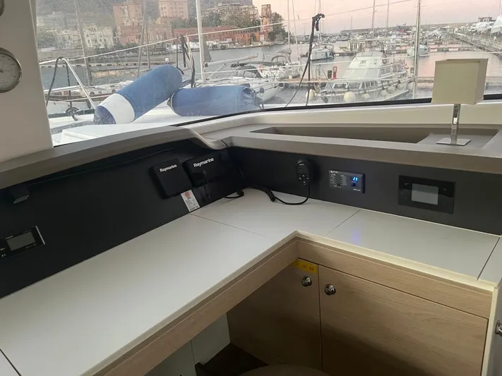  Yacht Photos Pics Modern navigation station on a 2019 Bali 4.3 catamaran, overlooking a marina.