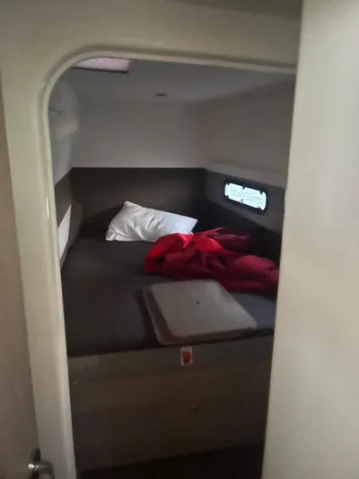  Yacht Photos Pics Cozy cabin interior of 2019 Bali 4.3 yacht with bed and window.