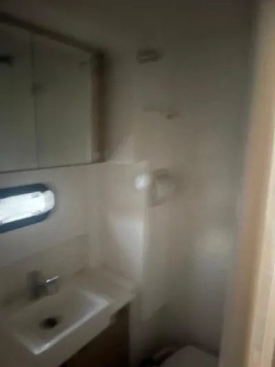  Yacht Photos Pics Small bathroom in a 2019 Bali 4.3 model, featuring a sink and mirror.
