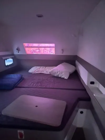  Yacht Photos Pics Cozy cabin interior of 2019 Bali 4.3 catamaran with bed and window view.