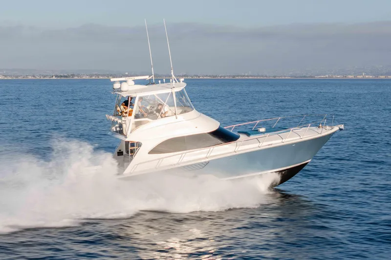 Chaser Yacht Photos Pics 2014 Viking 46 Convertible yacht cruising swiftly on open water.