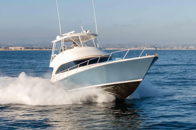 Chaser Yacht Photos Pics 2014 Viking 46 Convertible yacht cruising swiftly on open water.