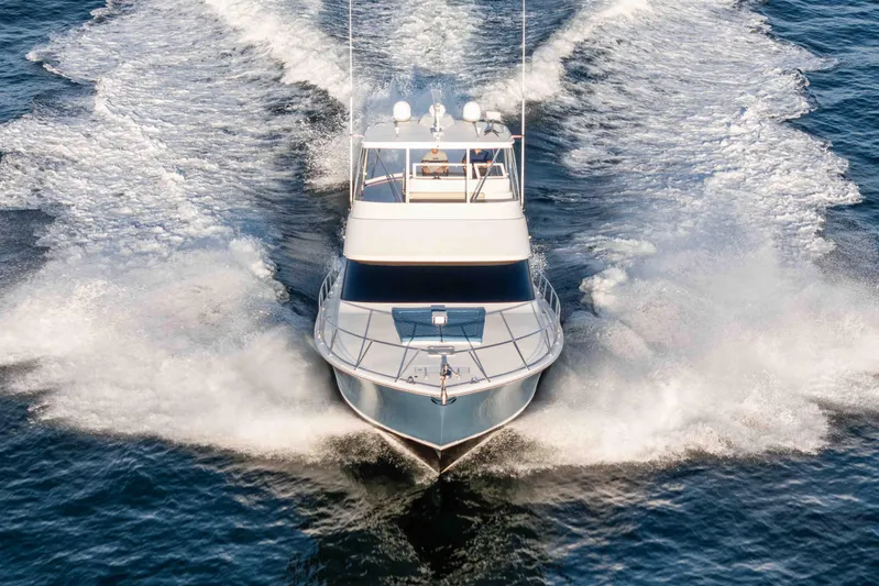 Chaser Yacht Photos Pics 2014 Viking 46 Convertible yacht cruising on open water, creating a dynamic wake.