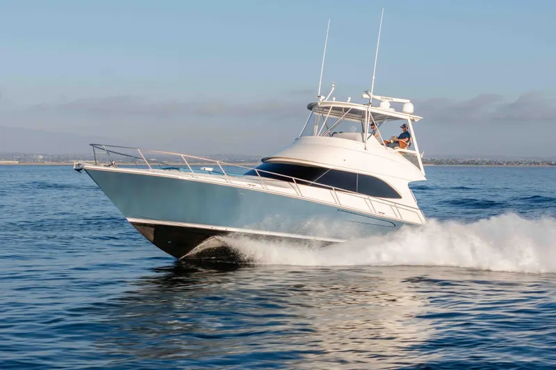 Chaser Yacht Photos Pics 2014 Viking 46 Convertible yacht cruising swiftly on open water.