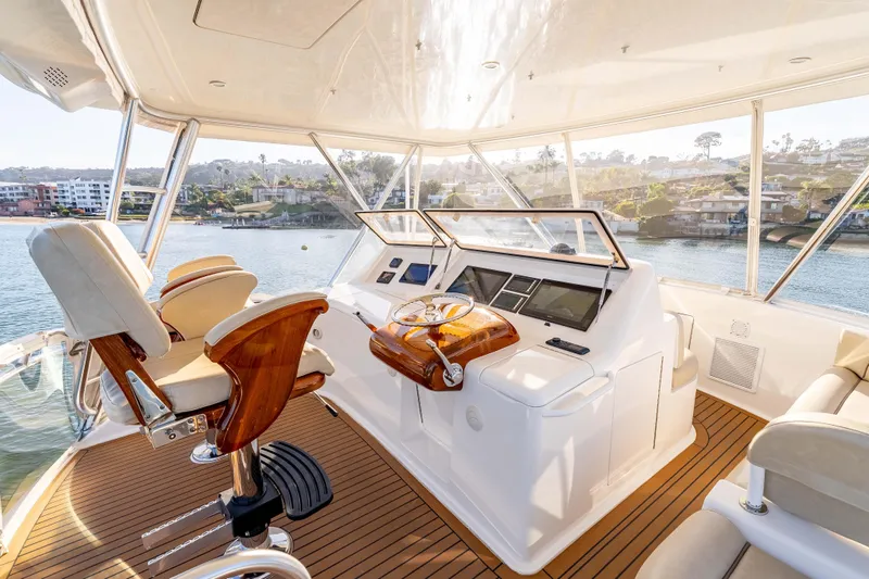 Chaser Yacht Photos Pics Luxurious interior of 2014 Viking 46 Convertible yacht with elegant helm and seating.